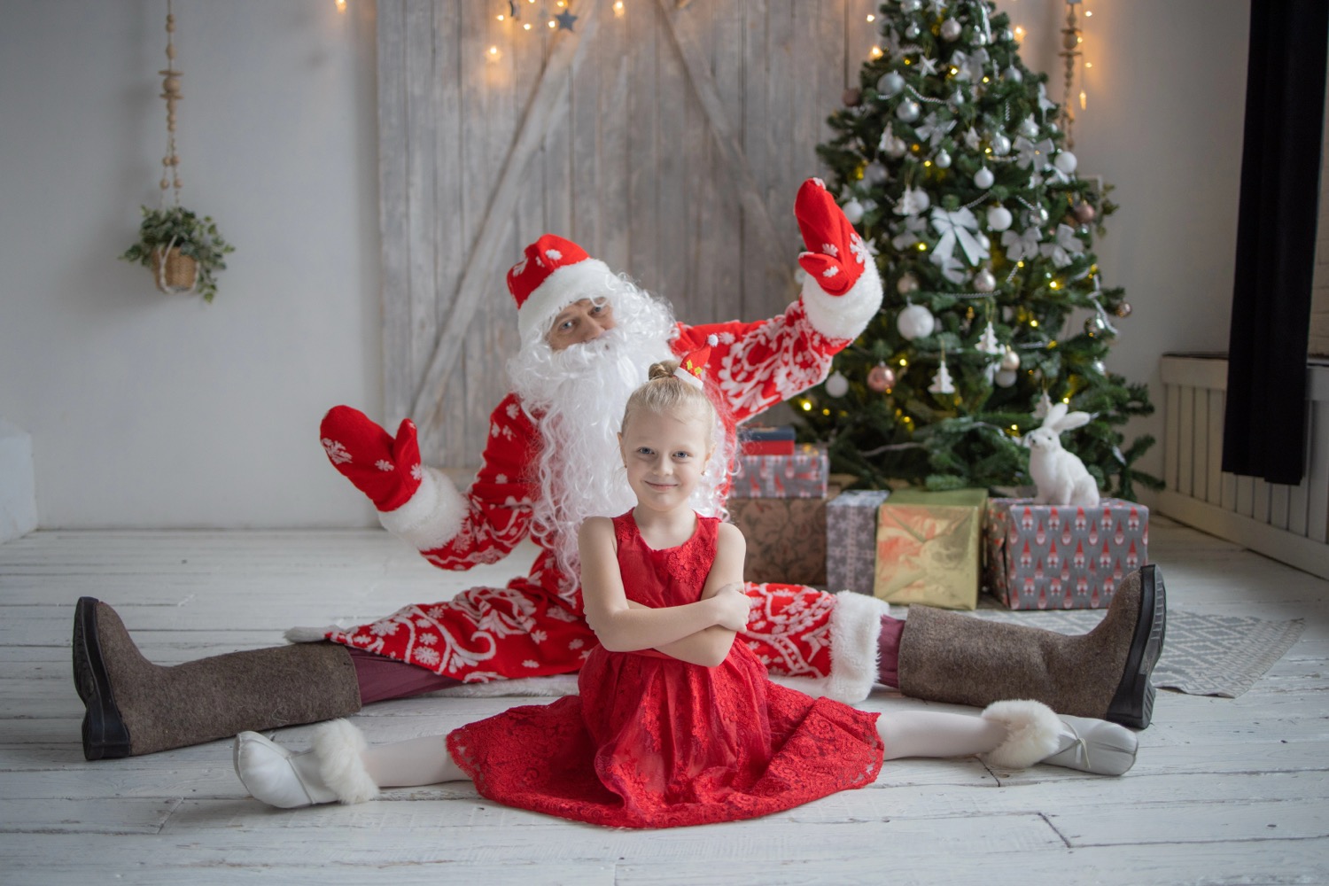 Child admiring Christmas tree decorations